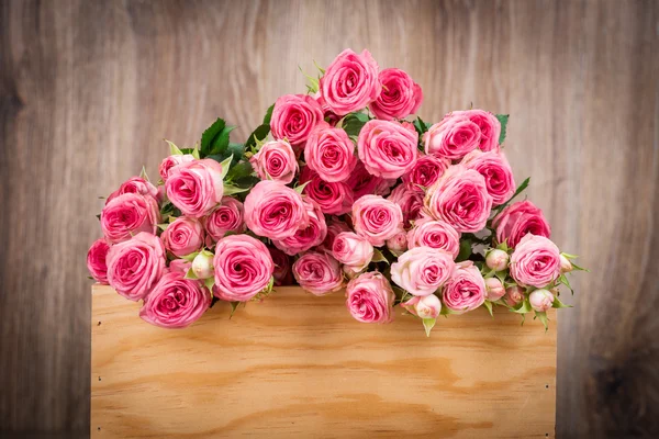 Roze rozen in vak — Stockfoto