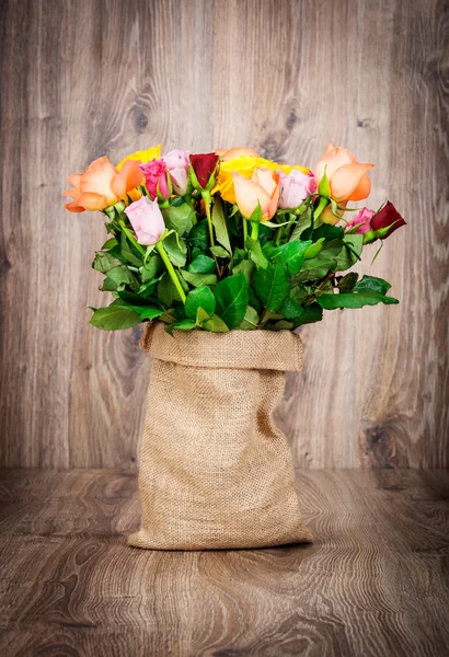 Beautiful roses in sack — Stock Photo, Image