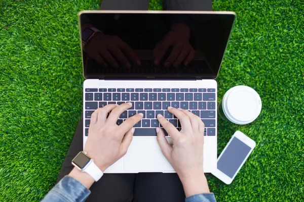 Typing on a laptop Stock Photo