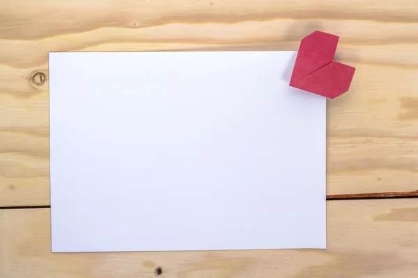 Valentines card with origami red heart on wooden table — Stock Photo, Image