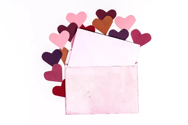 Vintage envelope with pink pages and hearts — Stock Photo, Image