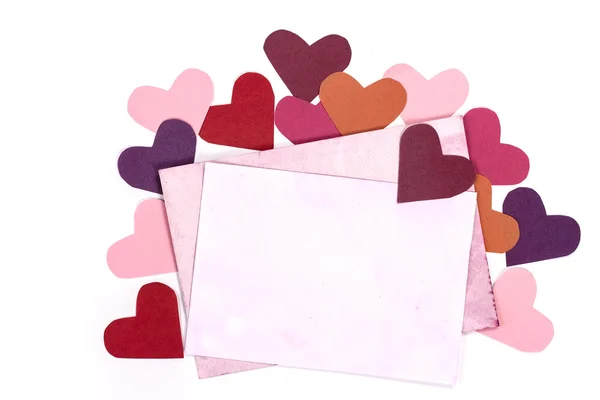 Pink envelope and color paper hearts — Stock Photo, Image