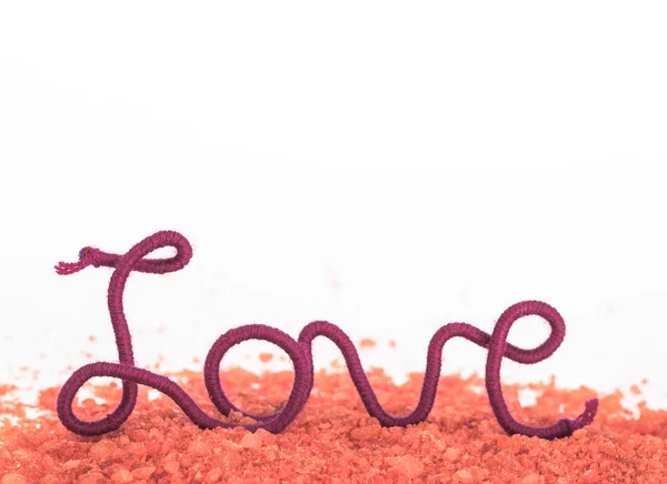 Word love of red thread on red background — Stock Photo, Image