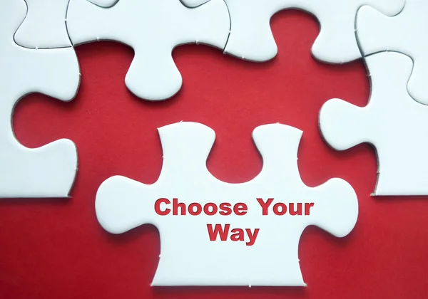 Dílky na červeném pozadí, motivační citát "vybrat Your Way" — Stock fotografie
