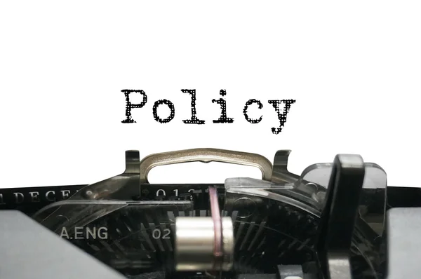 Policy on typewriter — Stock Photo, Image