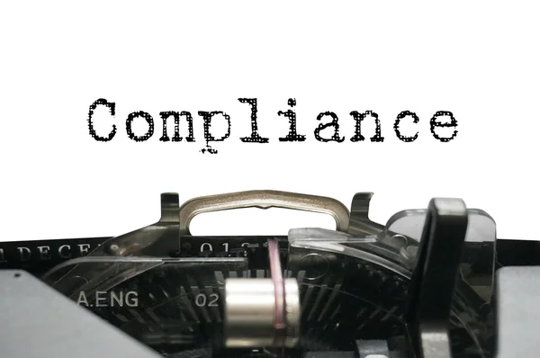 Compliance on typewriter — Stock Photo, Image