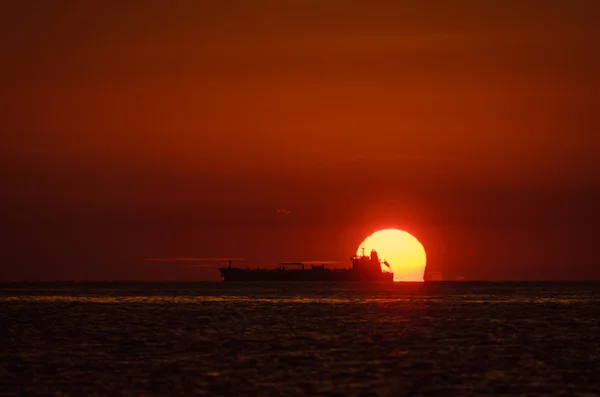 Cargo ship riding at anchor — Stock Photo, Image