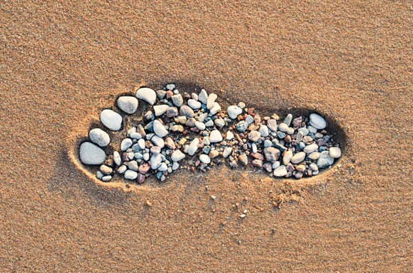 Voetstap op zandstrand — Stockfoto