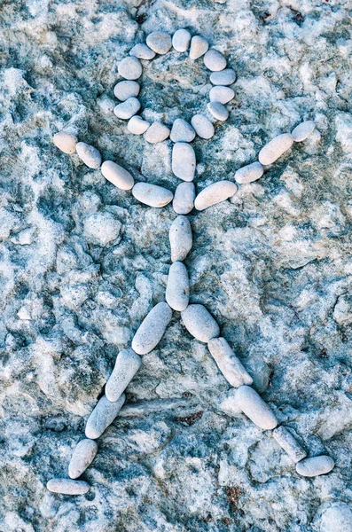 Figure from pebbles — Stock Photo, Image