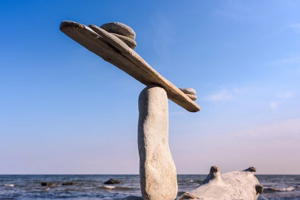 Stones on narrow plank — Stock Photo, Image