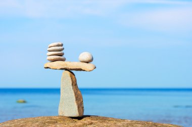 Balancing of white stones clipart