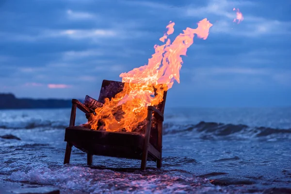 Burning old armchair — Stock Photo, Image