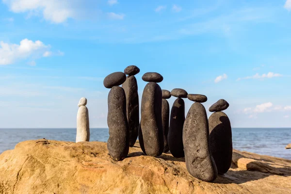 Pebbles on sea boulder — Stock Photo, Image