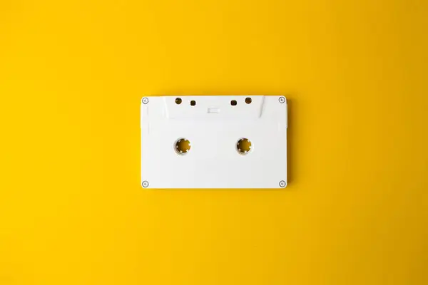 stock image Old white music cassette on a yellow background. Music. Retro.