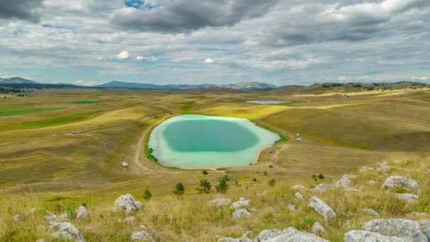 Vrazje jezero - Devils lake in Durmitor between wide natural green meadows near Zabljak, Montenegro. Timelapse 4K. — Stock Video