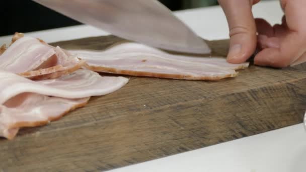 Bacon cutting and splitting from leather — Stock Video