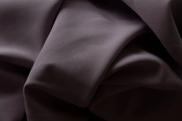 Крупним планом текстура фіолетової тканини або тканини фіолетового кольору. Тканинна текстура фіолетового фону. суміш фіолетової тканини . — стокове фото