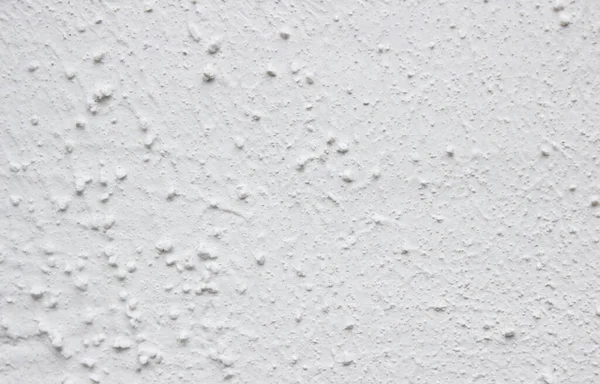 Doğal çimento ya da taş gibi eski dokunun soluk beyaz arka planı eski model bir duvar gibi..