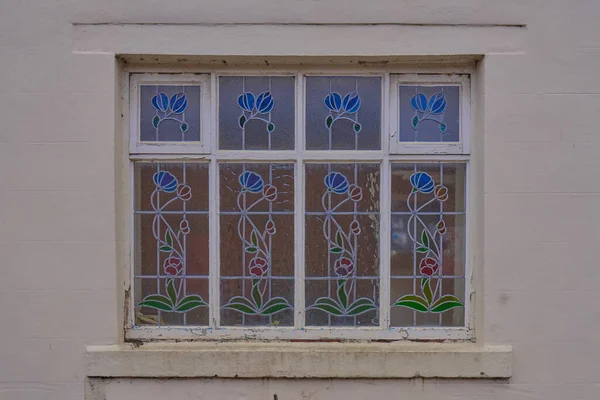 This blue and green leaded stained window was discovered on an old industrial estate