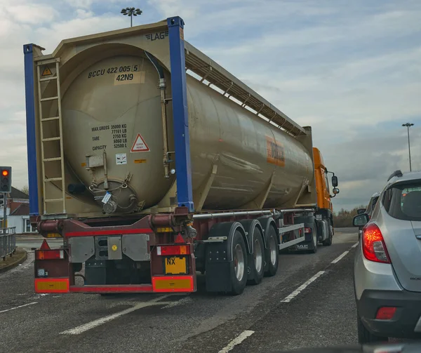 Tanker truck stopped at red traffic lights