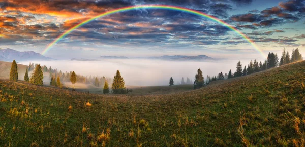 Rainbow over the Mountains. autumn morning in the Carpathians