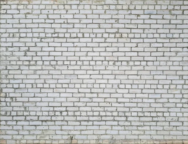 Szara ceglana ściana ze śladami zniszczenia i brudną fakturą — Zdjęcie stockowe