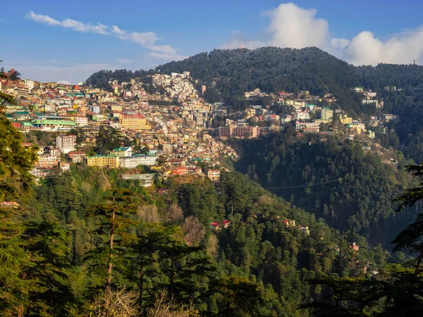 aerial view of beautiful city escape on mountains and cloudy sky in the background