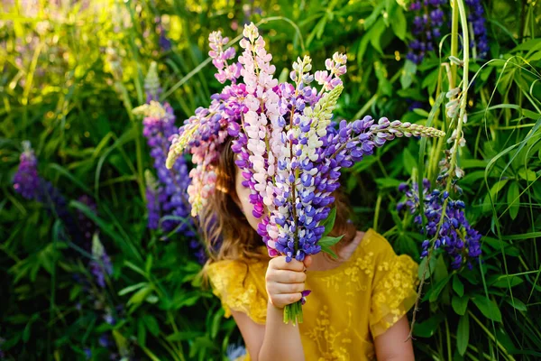 Girl Hides Face Bouquet Lupines Background Field Flowers Copy Space — Stock Photo, Image