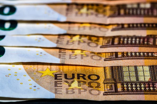 Selective focus on detail of euro banknotes. Close up macro detail of money banknotes, 50 euro isolated. World money concept, inflation and economy concept