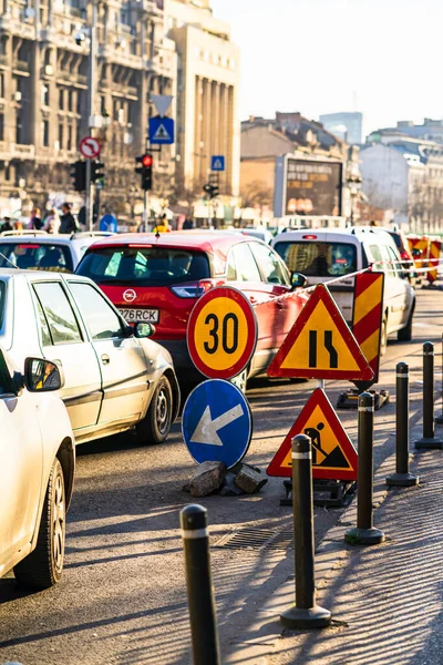 Speed limit, warning road signs located in working area. Bucharest, Romania, 2020 — Stock Image Speed Limit Warning Road Signs Located Working Area Bucharest Romania Stock Image