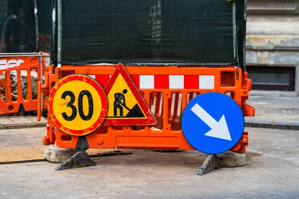 Speed limit, warning road signs located in working area. Bucharest, Romania, 2020 — Stock Image Speed Limit Warning Road Signs Located Working Area Bucharest Romania Stock Photo