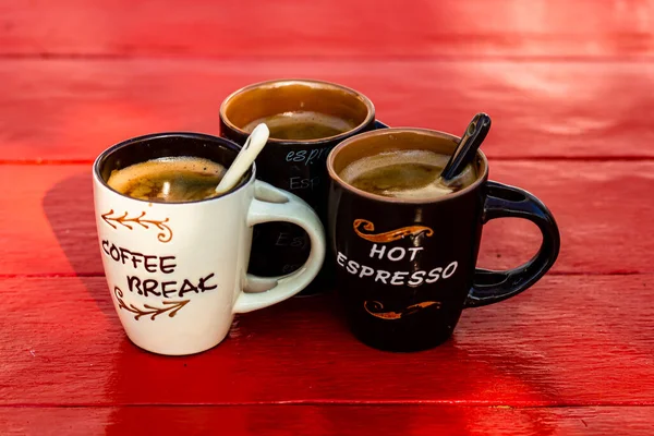 Cup of fresh made coffee on wooden background