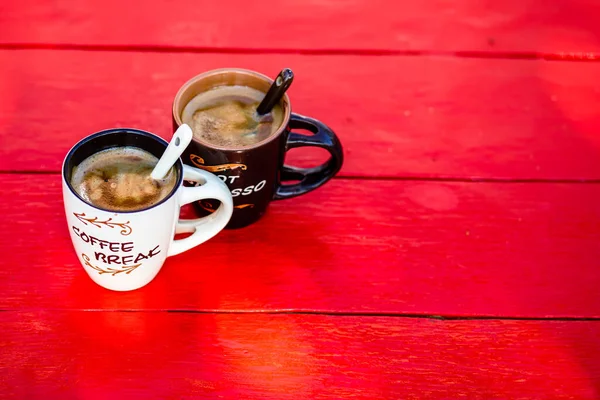 Cup of fresh made coffee on wooden background