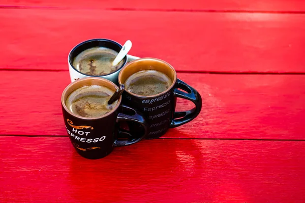 Cup of fresh made coffee on wooden background