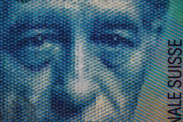 Selective focus on detail of 100 swiss franc banknote. Close up macro detail of money banknotes, swiss franc isolated.