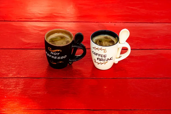 Cup of fresh made coffee on wooden background