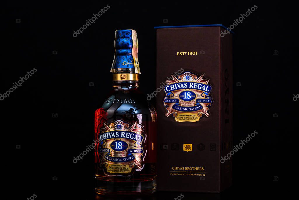 Chivas Regal 18 is blended from whiskies matured for at least 18 years. Whisky bottle on barrel. Illustrative editorial photo Bucharest, Romania, 2021