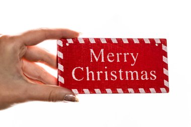 Beyaz arka planda Noel süsleri tutmak