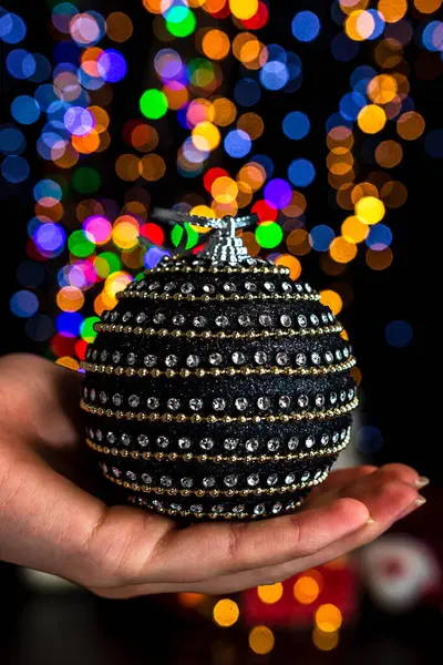 Holding Christmas Decoration Bokeh Lights Background — Stock Photo, Image