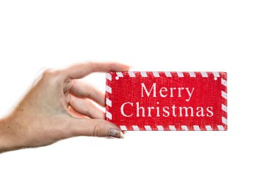 Beyaz arka planda Noel süsleri tutmak