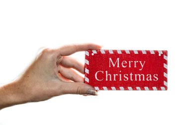 Beyaz arka planda Noel süsleri tutmak