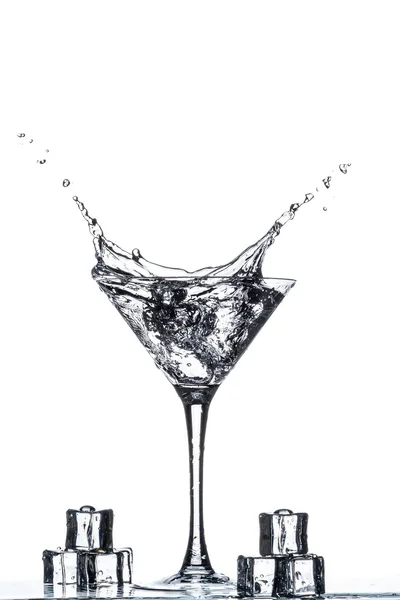 Martini glass with splash — Stock Photo, Image