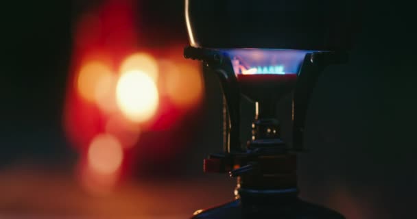 Close-up of a gas lamp with blurred fireplace in the background — Stock Video