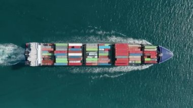 Aerial footage of a cargo ship sailing in open sea waters