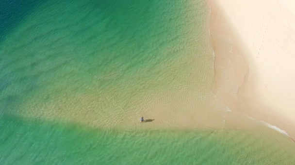 Aerial footage of the stunning isolated beach falling steeply into the sea — Αρχείο Βίντεο