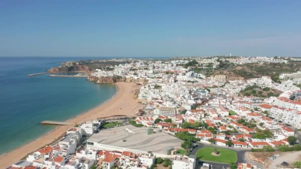 Albufeira, Portugal. Aerial view over beautiful seaside town by the ocean — Stockvideo