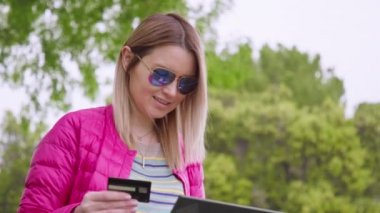Positive woman customer celebrating getting ecommerce shopping offer on laptop