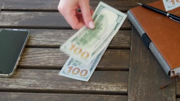 USD money banknotes in on wooden deck, womans hand counting cash money, RED 8K — Αρχείο Βίντεο