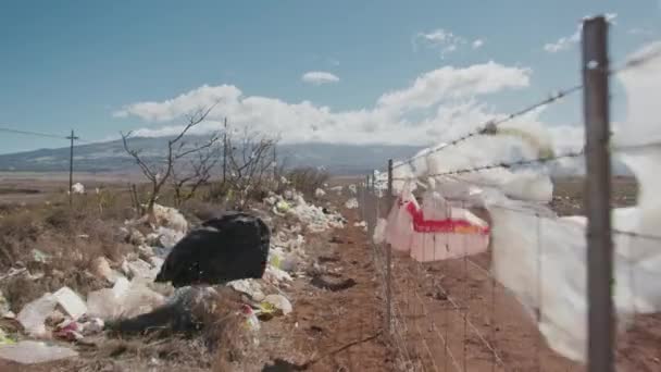 City dump view on landfill plastic bags flattering on barbed fence, Ugly view 4K — Stock Video