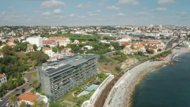 Aerial footage of the coastal town with port and modern architecture — Stock Video